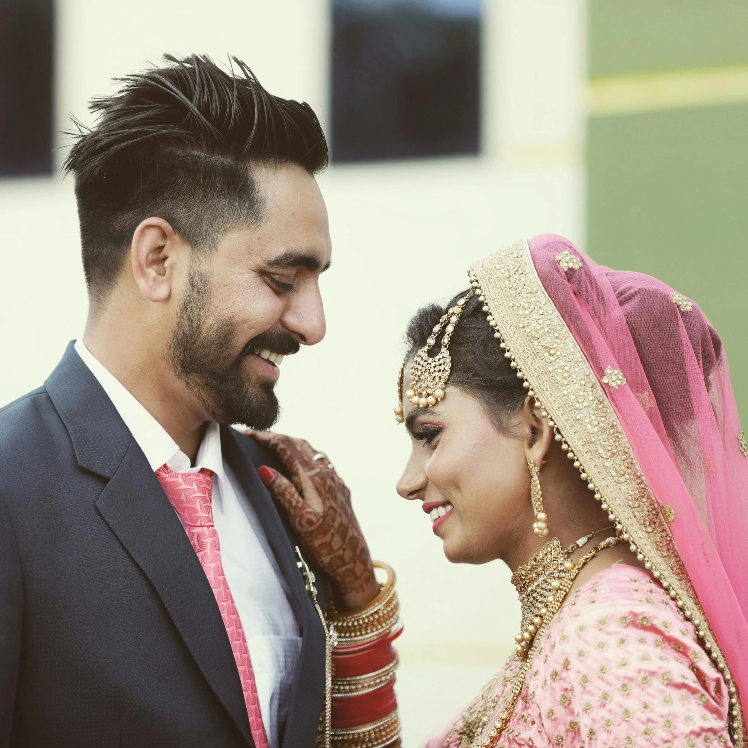 Newlywed Couple Smiling at Each Other